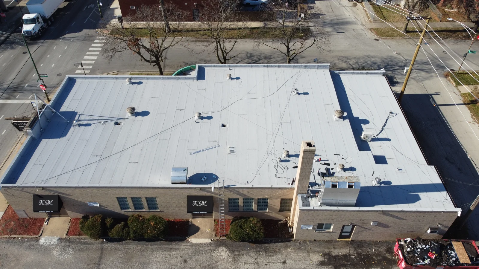 White coated commercial building roof seen from above in Chicagoland