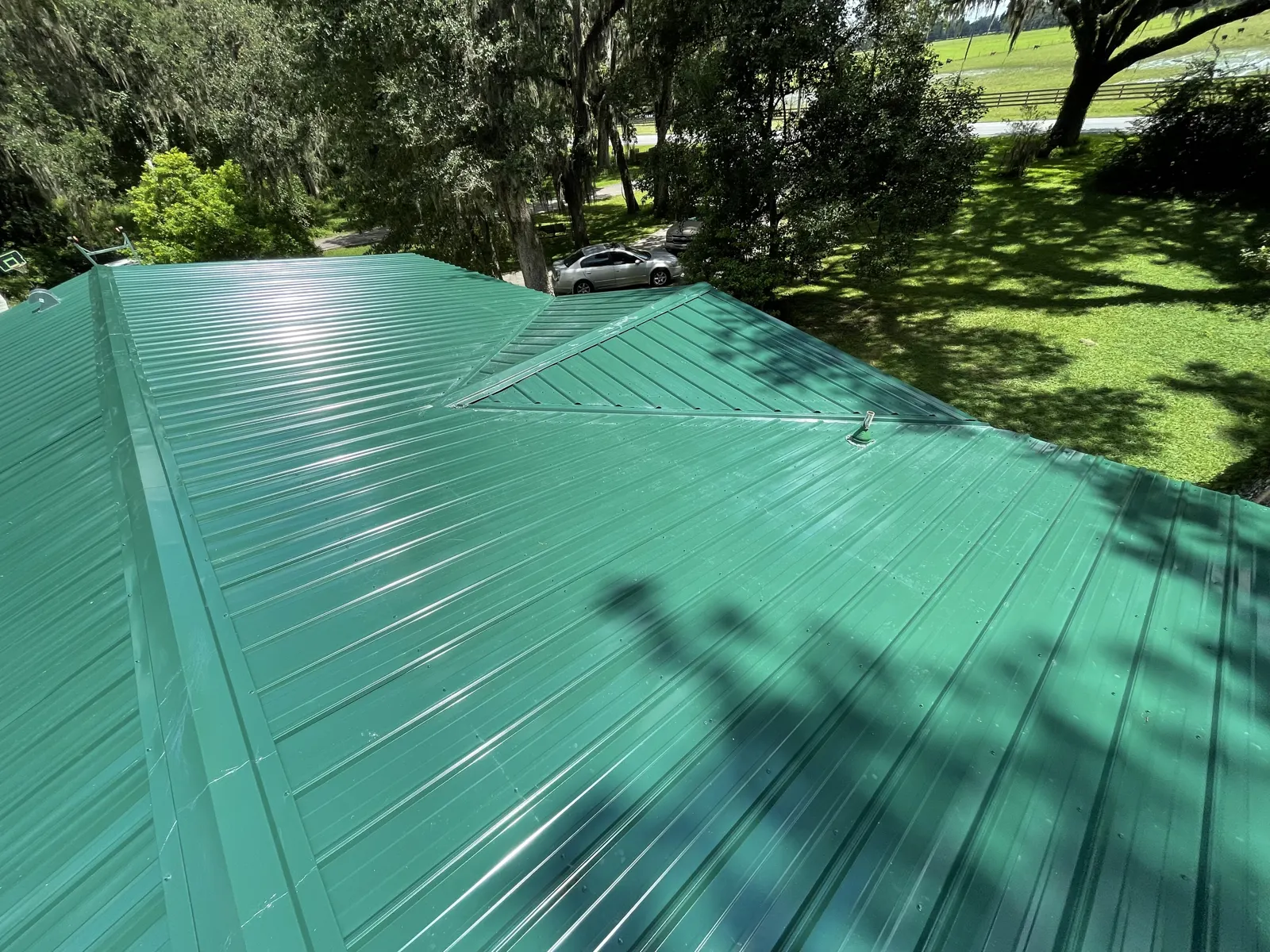 Green standing seam metal roof panels installed by Guardian Roofing Systems in Lake County, IL