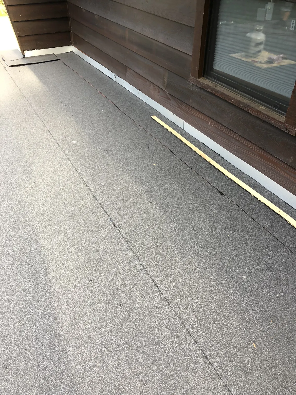 Modified bitumen low-slope balcony roof of the type common on Skokie, IL homes and small commercial buildings